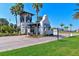 Community entrance with a charming gatehouse and lush landscaping creates a welcoming atmosphere at 850 Tidewater Shores Loop # 108, Bradenton, FL 34208