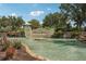 Community sign with a serene water feature and lush landscaping showcasing the Tidewater Reserve entrance at 850 Tidewater Shores Loop # 108, Bradenton, FL 34208
