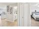 Hallway view showcases an open-concept floorplan between the kitchen, bathroom and bedroom at 850 Tidewater Shores Loop # 108, Bradenton, FL 34208