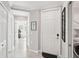 Inviting hallway with tile flooring, neutral tones, and access to multiple rooms at 850 Tidewater Shores Loop # 108, Bradenton, FL 34208