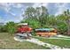 Outdoor kayak storage rack with multiple colorful kayaks ready for residents to use at 850 Tidewater Shores Loop # 108, Bradenton, FL 34208