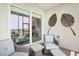 Comfortable screened lanai with views through to the waterfront and surrounding foliage at 850 Tidewater Shores Loop # 108, Bradenton, FL 34208