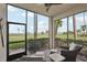 Relaxing screened lanai with comfortable seating area and views of the water at 850 Tidewater Shores Loop # 108, Bradenton, FL 34208