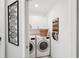 Functional laundry room features washer, dryer, and storage cabinets at 850 Tidewater Shores Loop # 108, Bradenton, FL 34208
