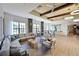 Spacious living room with comfortable seating, modern lighting, and large windows for natural light at 850 Tidewater Shores Loop # 108, Bradenton, FL 34208