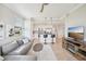 Comfortable living room seamlessly connecting to a stylish kitchen with stainless steel appliances at 850 Tidewater Shores Loop # 108, Bradenton, FL 34208