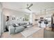 Open-concept living room flowing into a well-equipped kitchen with bar seating and modern finishes at 850 Tidewater Shores Loop # 108, Bradenton, FL 34208