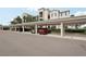 Covered parking area offering multiple parking spots with manicured landscaping at 850 Tidewater Shores Loop # 108, Bradenton, FL 34208
