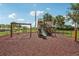 Community playground with a swing set and slide is ideal for outdoor fun and recreation at 850 Tidewater Shores Loop # 108, Bradenton, FL 34208