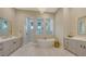 The bathroom offers a soaking tub, dual vanities, and walk-in shower at 8537 Pavia Way, Bradenton, FL 34202