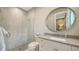 Bright bathroom featuring modern fixtures, a spacious vanity, and a sleek glass-enclosed shower at 8537 Pavia Way, Bradenton, FL 34202