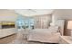 Bright bedroom with large windows offering stunning water views, creating a serene and luxurious retreat at 8537 Pavia Way, Bradenton, FL 34202