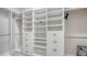 A walk-in closet with custom shelving and storage solutions at 8537 Pavia Way, Bradenton, FL 34202