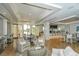 Elegantly designed dining area with modern furnishings and beautiful natural light at 8537 Pavia Way, Bradenton, FL 34202