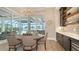 Bright dining area with views of the pool and outdoor living space at 8537 Pavia Way, Bradenton, FL 34202