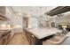 Stunning kitchen features a large island, stainless appliances, and custom cabinetry at 8537 Pavia Way, Bradenton, FL 34202