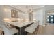 Bright kitchen with white cabinetry, stainless steel appliances, and a large center island at 8537 Pavia Way, Bradenton, FL 34202