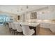 Elegant kitchen featuring a large island with seating, pendant lights, and modern appliances at 8537 Pavia Way, Bradenton, FL 34202