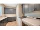 Spacious laundry room features modern appliances, cabinetry, and a countertop for folding and organizing laundry at 8537 Pavia Way, Bradenton, FL 34202