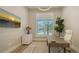 Bright office space featuring a large window, hardwood floors, and a modern aesthetic at 8537 Pavia Way, Bradenton, FL 34202