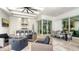 Outdoor living area with fire pit, seating, and outdoor kitchen at 8537 Pavia Way, Bradenton, FL 34202