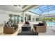 Spacious outdoor living area with pool and fire pit seating at 8537 Pavia Way, Bradenton, FL 34202