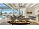 Outdoor living space features a pool, lake views, and a bar area at 8537 Pavia Way, Bradenton, FL 34202