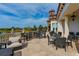 Outdoor seating area with lake views and comfortable furniture at 8537 Pavia Way, Bradenton, FL 34202