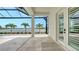 Covered patio with tiled floor and a beautiful view of the lake at 8537 Pavia Way, Bradenton, FL 34202