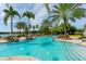 Resort-style pool with water features, lush landscaping, and comfortable lounge seating at 8537 Pavia Way, Bradenton, FL 34202