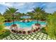 Gorgeous community pool area with lush landscaping, lounge chairs, and inviting waters at 8537 Pavia Way, Bradenton, FL 34202