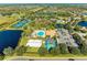 Aerial view of community amenities including tennis courts, pool and beach volleyball at 8772 Stone Harbour Loop, Bradenton, FL 34212