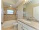 Updated bathroom with neutral tile, granite counters and shower at 8772 Stone Harbour Loop, Bradenton, FL 34212