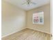 Bright bedroom with wood-look flooring and a ceiling fan at 8772 Stone Harbour Loop, Bradenton, FL 34212