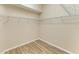 Walk-in closet with shelves and wooden-look tile floor at 8772 Stone Harbour Loop, Bradenton, FL 34212