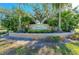 Beautiful community entrance with lush landscaping, mature trees, and welcoming signage at 8772 Stone Harbour Loop, Bradenton, FL 34212