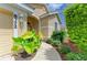 Inviting front entry with walkway and lush, mature landscaping at 8772 Stone Harbour Loop, Bradenton, FL 34212