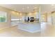 Bright kitchen featuring white cabinets, granite countertops, stainless steel appliances, and neutral tile flooring at 8772 Stone Harbour Loop, Bradenton, FL 34212