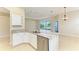 Kitchen island featuring granite countertops and stainless steel appliances in an open-concept space at 8772 Stone Harbour Loop, Bradenton, FL 34212