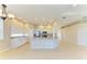 Spacious kitchen featuring a center island with granite counters, stainless steel appliances, and an open floor plan at 8772 Stone Harbour Loop, Bradenton, FL 34212