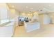 Kitchen featuring white cabinetry, granite countertops, stainless steel appliances, and tile flooring at 8772 Stone Harbour Loop, Bradenton, FL 34212