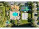 Aerial view of the recreation area with beach volleyball, shuffleboard, bocce ball, and pool at 8772 Stone Harbour Loop, Bradenton, FL 34212