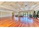 Spacious recreation room with hardwood floors, large windows, and ample natural light at 8772 Stone Harbour Loop, Bradenton, FL 34212