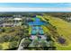 Aerial view of the community tennis courts located by the lake at 8772 Stone Harbour Loop, Bradenton, FL 34212