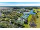 Aerial view of the community tennis courts by a lake at 8772 Stone Harbour Loop, Bradenton, FL 34212
