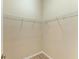 Spacious walk-in closet features built-in wire shelving and wood-look floors at 8772 Stone Harbour Loop, Bradenton, FL 34212