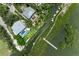 Waterfront homes with private docks along scenic waterway, enhanced by lush mangroves and mature trees at 8963 Fishermens Bay Dr, Sarasota, FL 34231