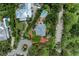 Overhead view of an estate showcasing the layout, landscaping, pool, and proximity to nearby properties at 8963 Fishermens Bay Dr, Sarasota, FL 34231