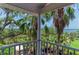 Balcony view overlooking lush tropical foliage and tranquil waterway at 8963 Fishermens Bay Dr, Sarasota, FL 34231