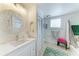 This bathroom features a decorative mirror, recessed wall niche and shower/tub combo at 8963 Fishermens Bay Dr, Sarasota, FL 34231